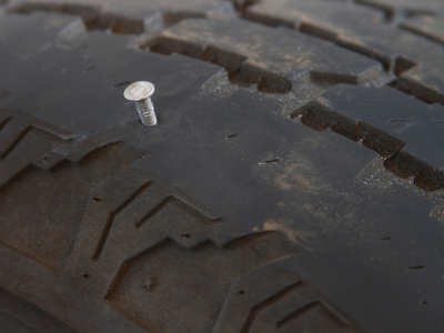 Nail_in_a_Tire_causing_leak.jpg