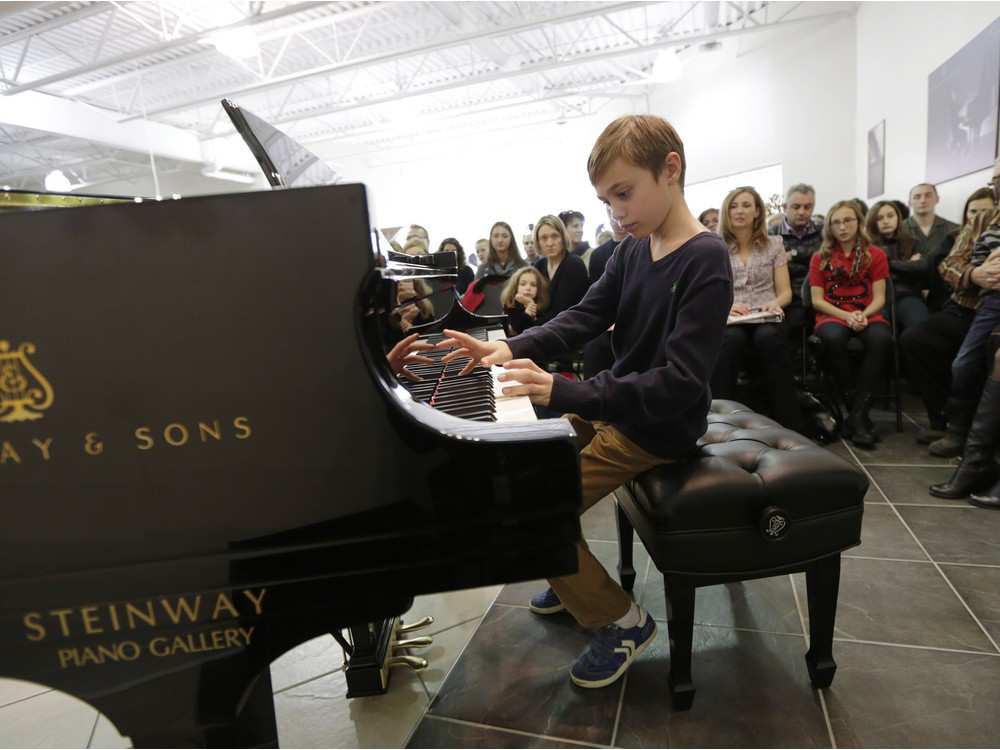 noah-petrie-plays-on-a-220000-piano-during-a-recital-at-th.jpeg