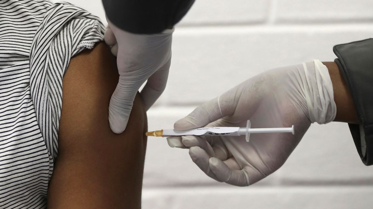 A volunteer receives an injection at the Chris Hani Baragwanath hospital on the outskirts of Johannesburg, on June 24 as part of South Africa's first participation in an Oxford/AstraZeneca vaccine trial. 