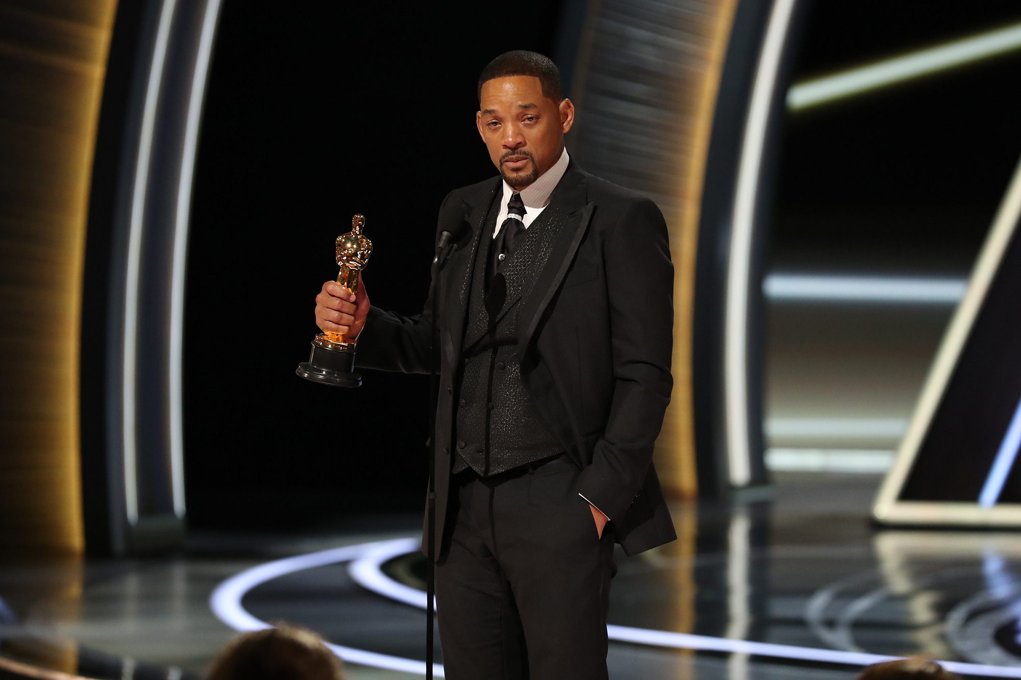 Will Smith accepts the award for best actor in a leading role for King Richard onstage during the 94th Academy Awards on March 27. 