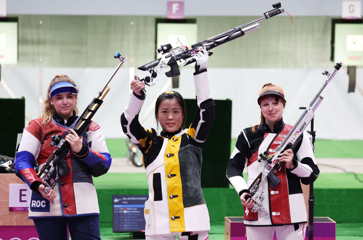 From left: Anastasiia Galashina of Russia, Yang Qian of China, and third-placed Nina Christen of Switzerland at the end of the 10m Air Rifle Women's Final.