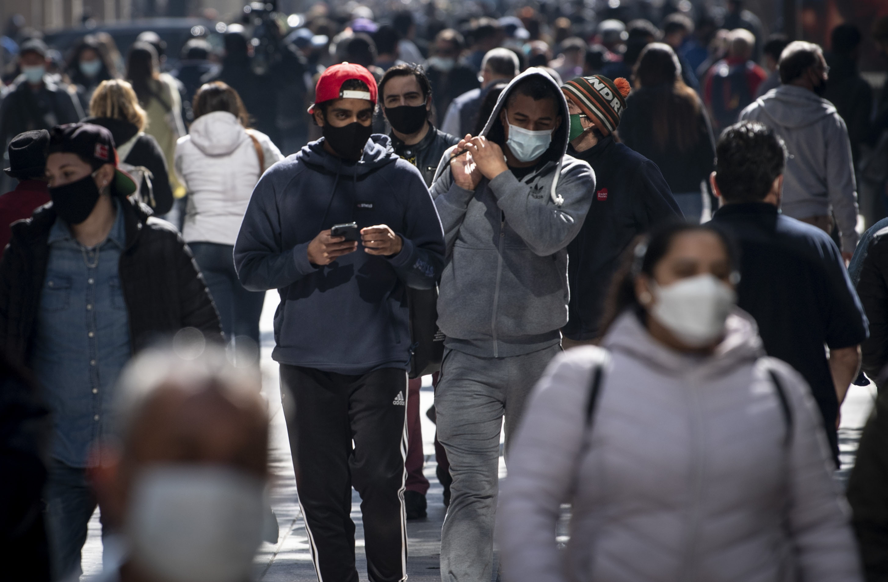 People walk in Santiago, Chile, on August 17.