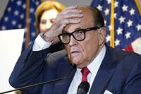 FILE - In this Nov. 19, 2020, file photo, former New York Mayor Rudy Giuliani, who was a lawyer for President Donald Trump, speaks during a news conference at the Republican National Committee headquarters in Washington.  The House committee investigating the Capitol insurrection has issued subpoenas to some of Donald Trump's closest advisers, including Rudy Giuliani  Sidney Powell stands behind. (AP Photo/Jacquelyn Martin, File)