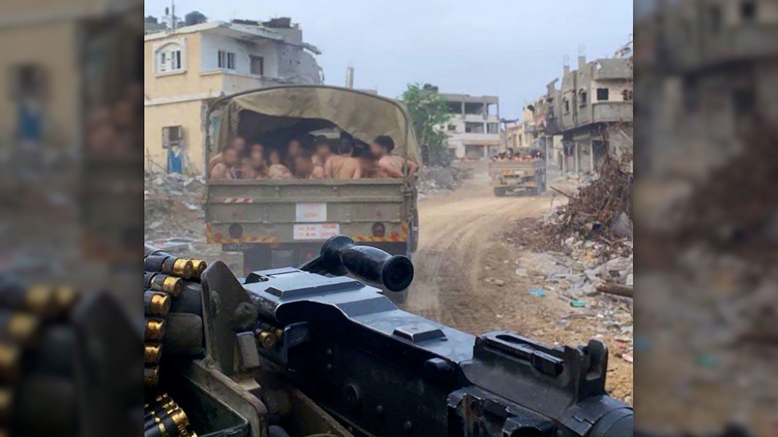 Images from Gaza circulating on social media Thursday showed a mass detention by the Israeli military of men who were made to strip to their underwear, kneel on the street, wear blindfolds and pack into the cargo bed of a military vehicle.