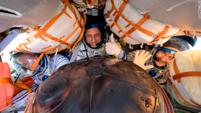 NASA astronaut Mark Vande Hei (left) and Russian cosmonauts Anton Shkaplerov, (center) and Pyotr Dubrov are seen inside their Soyuz MS-19 spacecraft after landing.