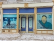 a photo of the Moments of Respite exhibition on Sparks Street, showing both Inuit artwork and photography. 