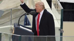 TOPSHOT - US President Donald Trump salutes the crowd after the swearing-in ceremony as 45th President of the USA in front of the Capitol in Washington on January 20, 2017.  / AFP / Timothy A. CLARY        (Photo credit should read TIMOTHY A. CLARY/AFP via Getty Images)