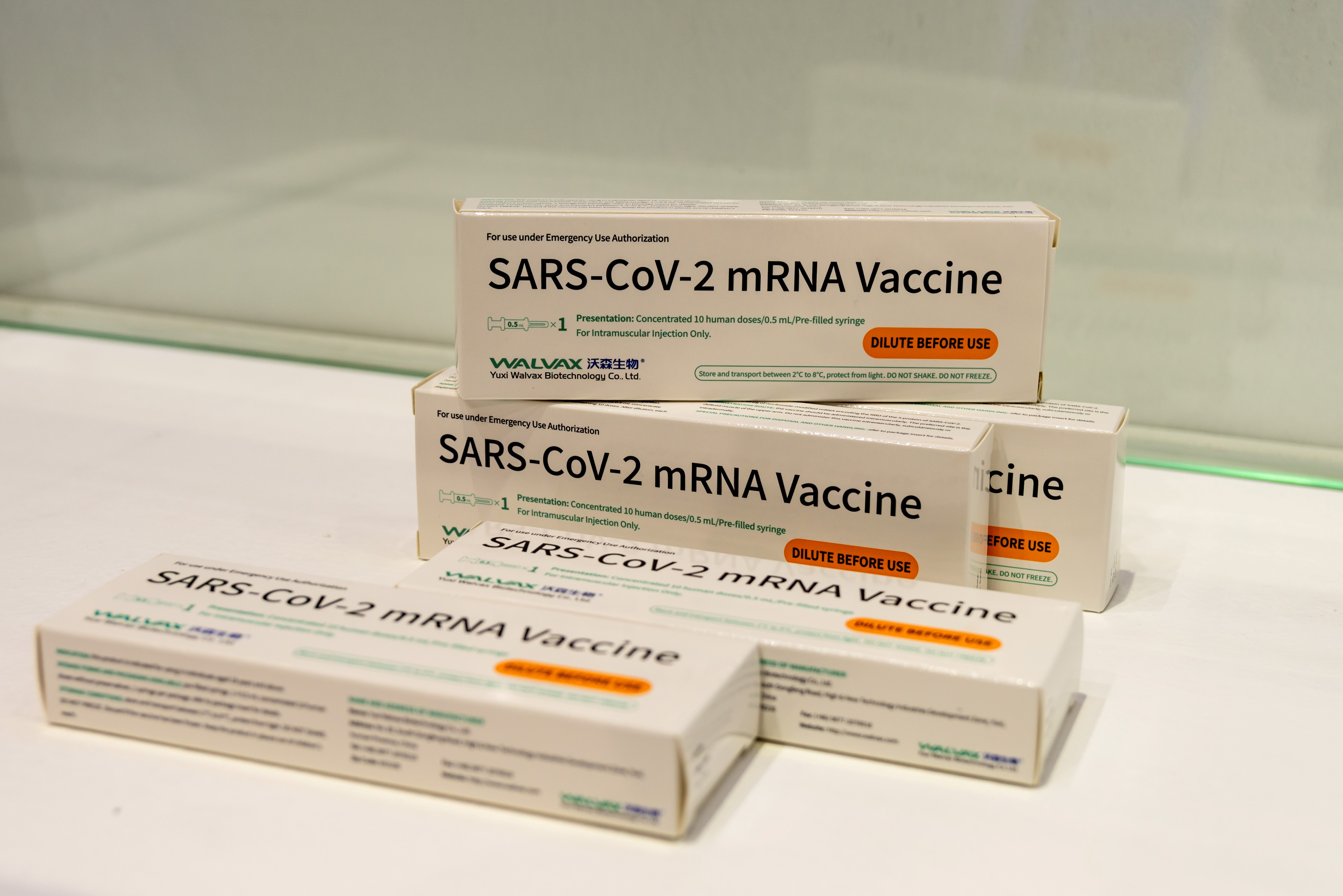 Boxes of Walvax Biotechnology's messenger RNA (mRNA) vaccine against the coronavirus disease (COVID-19) are seen displayed at a trade fair in Shanghai, China April 16, 2021. China Daily via REUTERS  