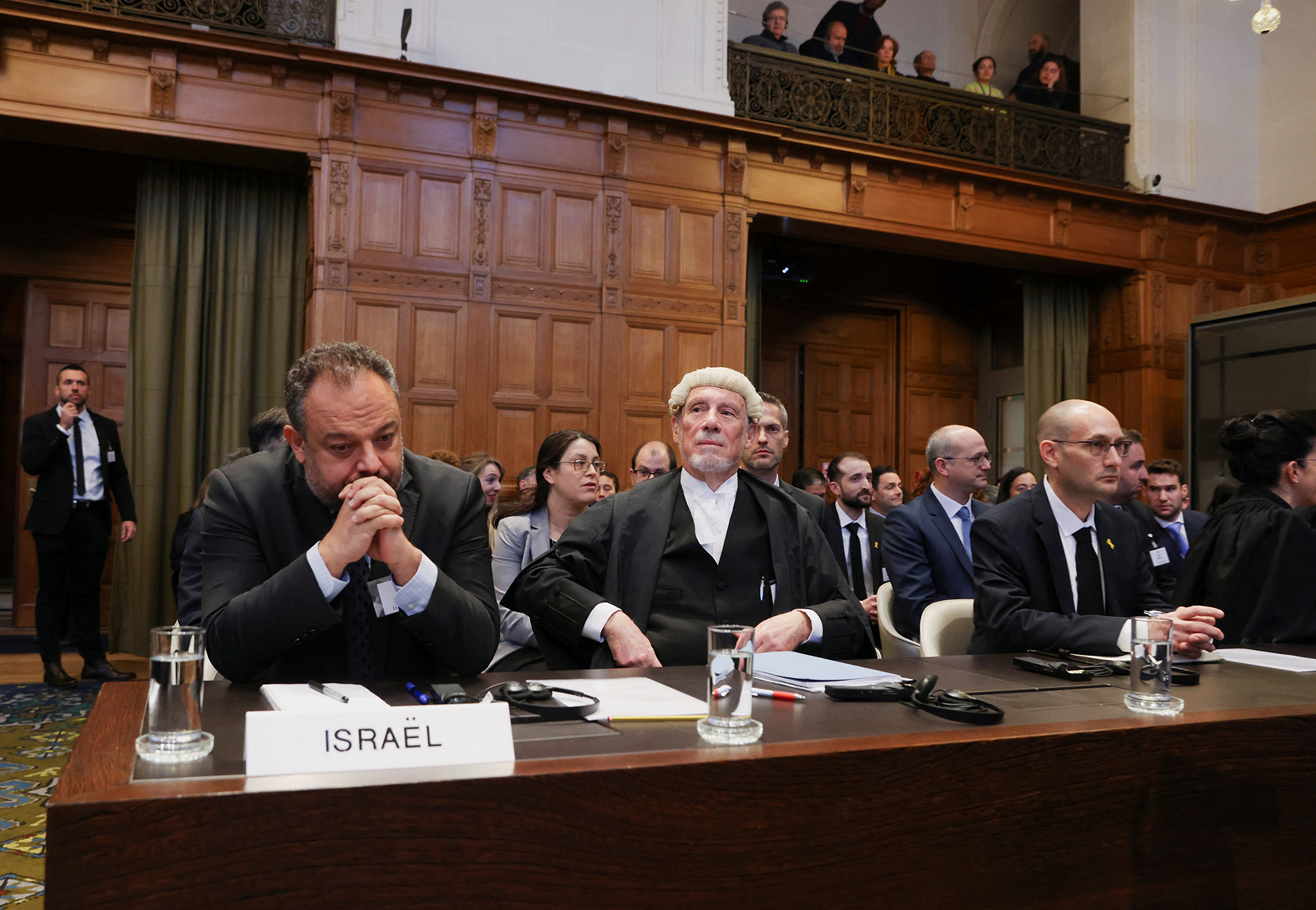 British jurist Malcom Shaw, center, legal adviser to Israel's Foreign Ministry Tal Becker, left, and Israel's deputy attorney-general for international law Gilad Noam look on as judges at the International Court of Justice (ICJ) hear a request for emergency measures by South Africa in The Hague, Netherlands, on January 11.