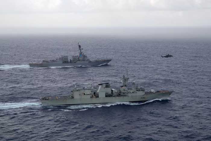 U.S. Navy guided-missile destroyer USS Chung-Hoon sails alongside the Royal Canadian Navy frigate HMCS Montreal during Surface Action Group operations as a part of exercise “Noble Wolverine” in the South China Sea May 30, 2023