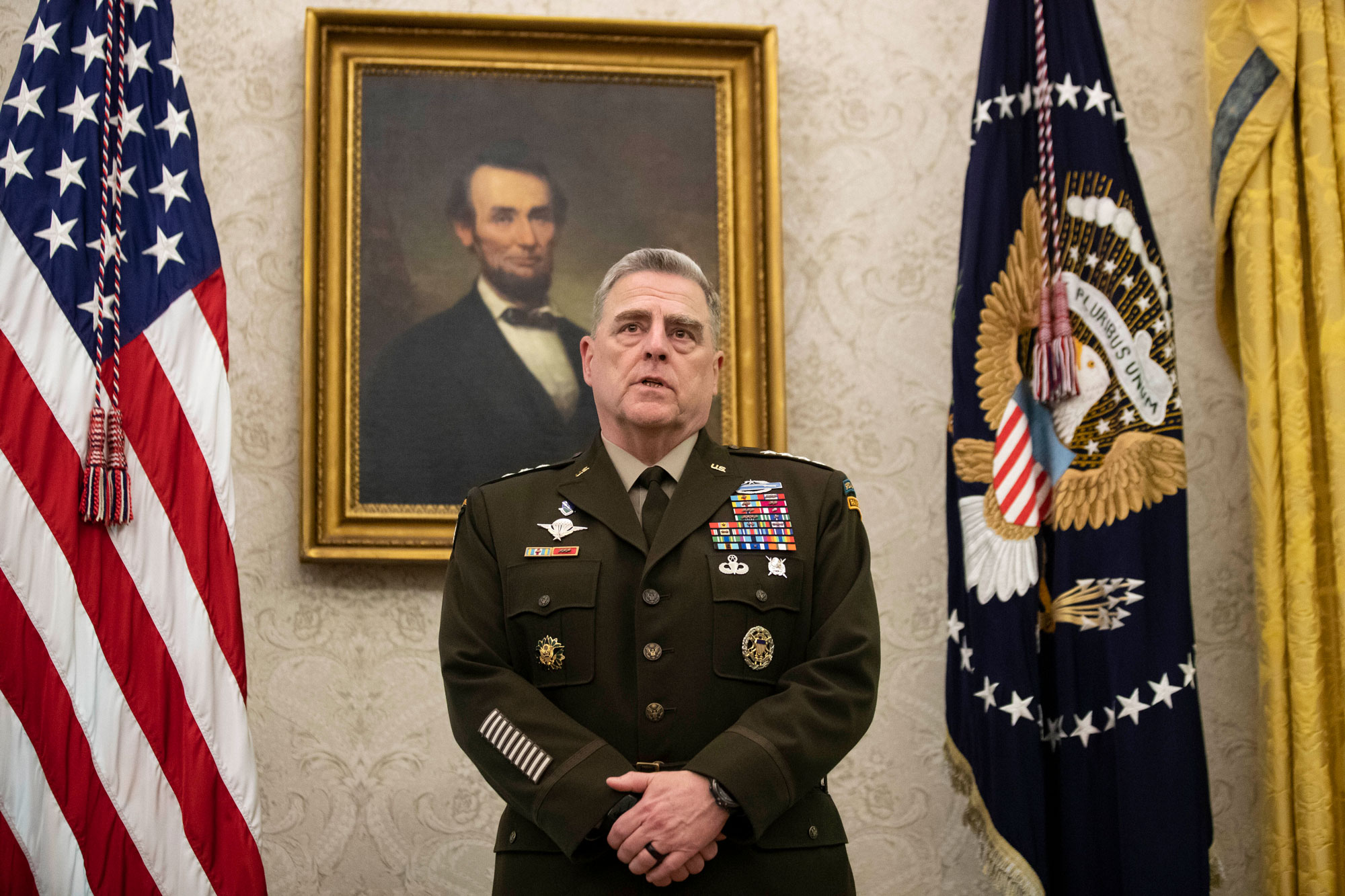 Joint Chiefs Chairman Gen. Mark Milley speaks during a presentation in the Oval Office of the White House with President Donald Trump on May 15 in Washington.