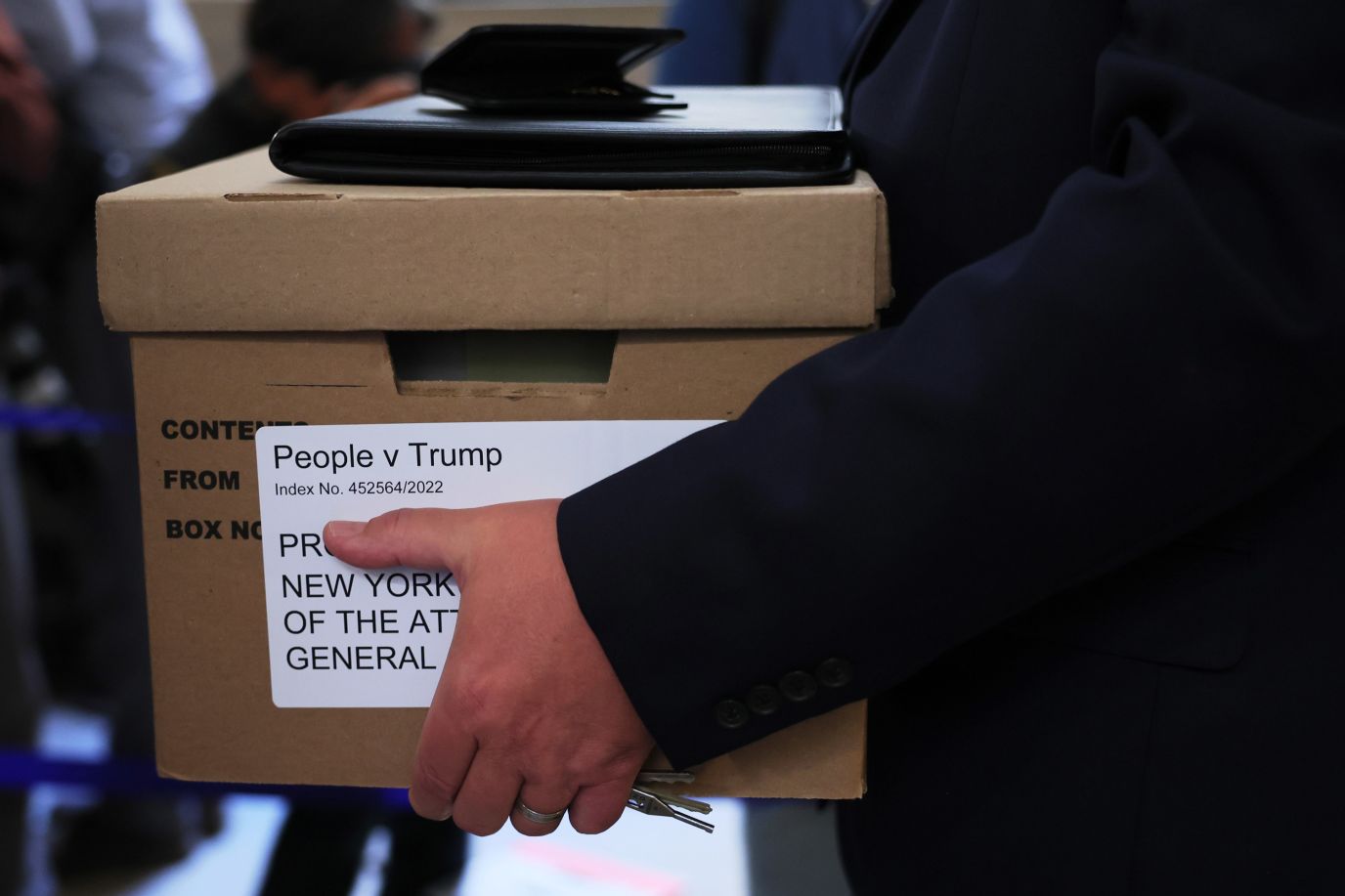 A box is carried at the courthouse before the start of the trial. 