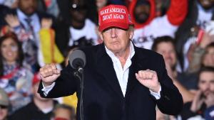 TOPSHOT - Former US President Donald Trump gestures as he speaks during a rally at the Canyon Moon Ranch festival grounds in Florence, Arizona, southeast of Phoenix, on January 15, 2022, - Thousands of Donald Trump supporters gathered in Arizona on Saturday to hear a raft of speakers claim the 2020 US election was stolen, with the former president expected to take to the stage as the headline act. (Photo by Robyn Beck / AFP) (Photo by ROBYN BECK/AFP via Getty Images)