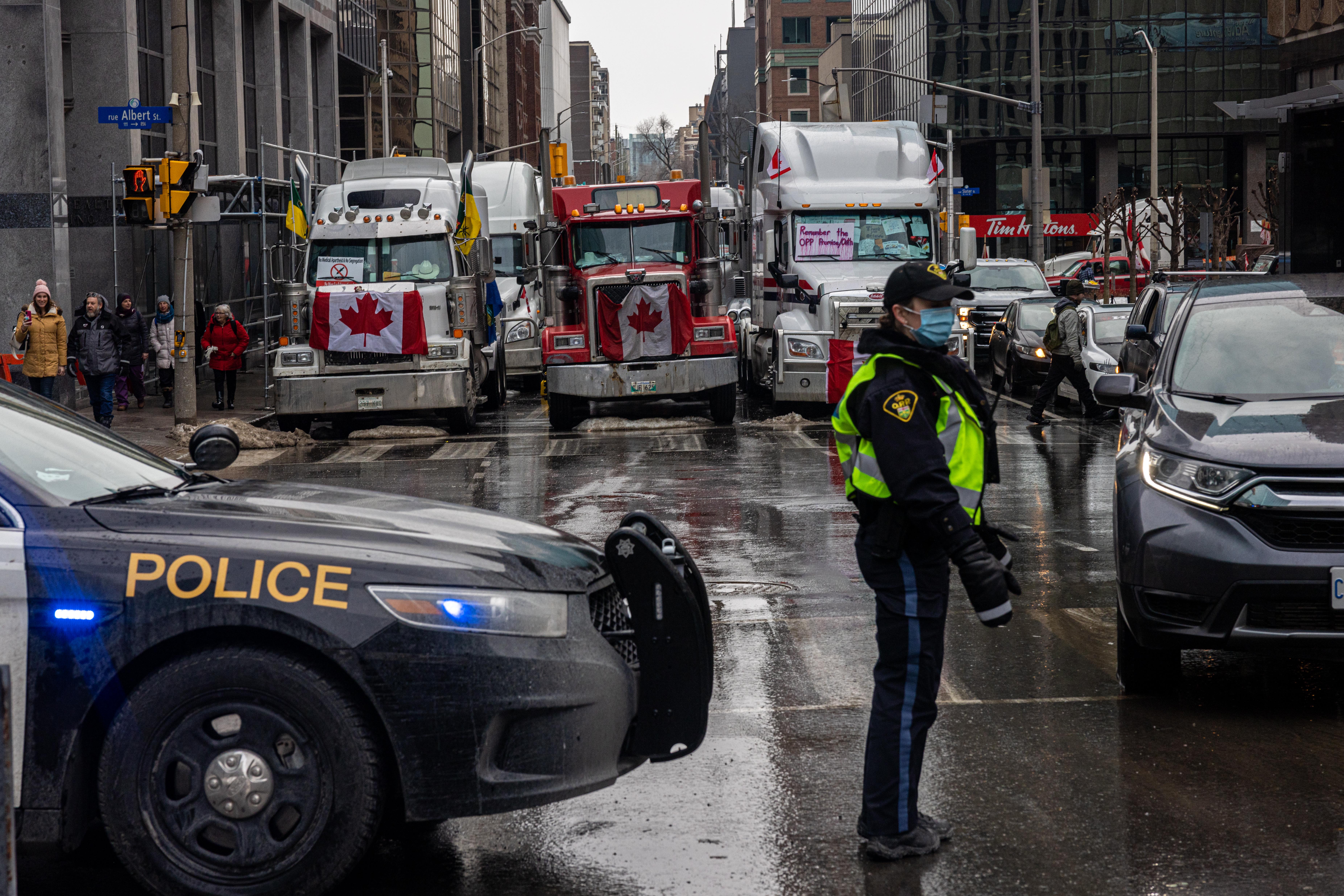 Police monitor access one of the roads near Parliament Hill on Thursday in Ottawa, Canada.