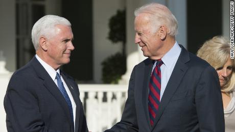 US Vice President Joe Biden shakes hands with Vice President-elect Mike Pence (L) following lunch at the Naval Observatory in Washington, DC, November 16, 2016. / AFP / SAUL LOEB        (Photo credit should read SAUL LOEB/AFP via Getty Images)