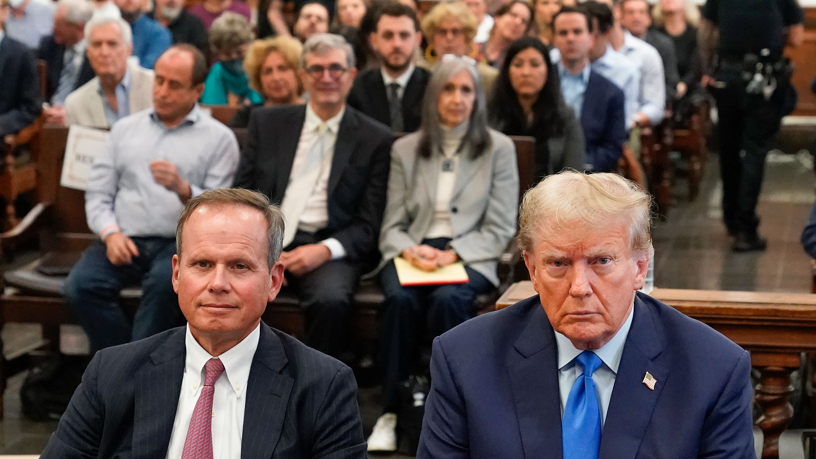 Former President Donald Trump, right, sits with his lawyer Chris Kise, left, in the courtroom at New York Supreme Court on Monday in New York.