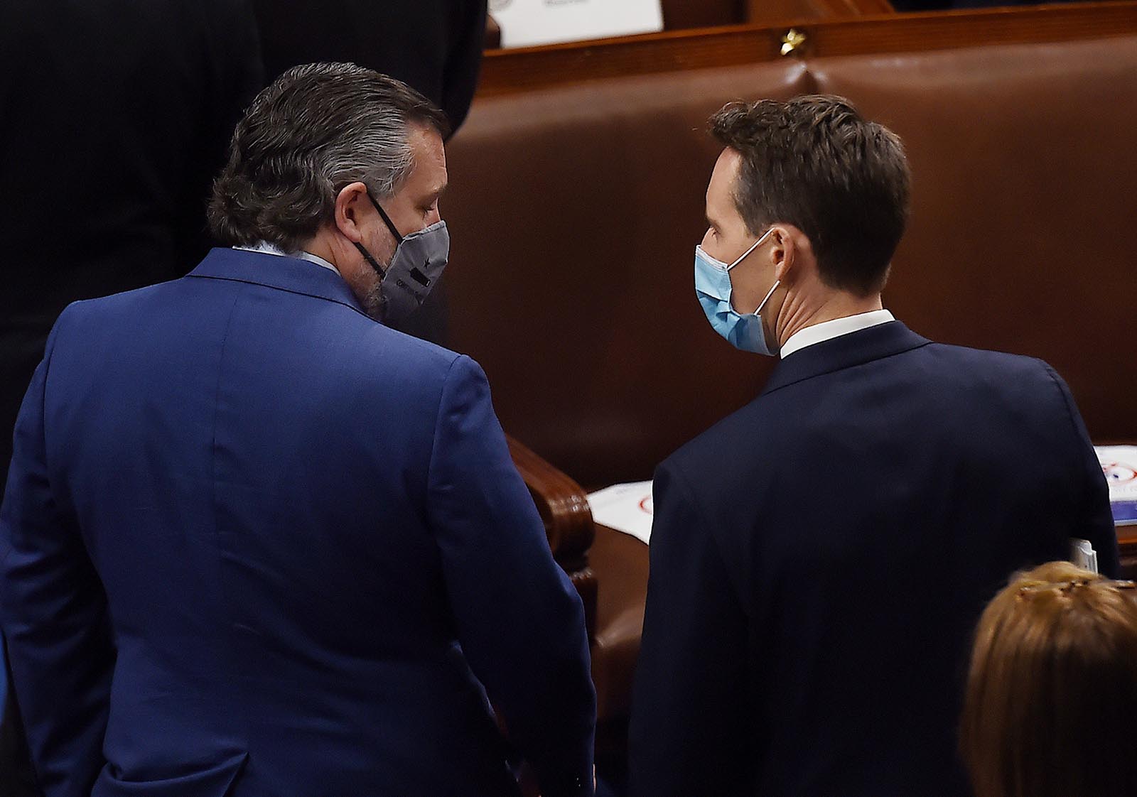 US Senator Ted Cruz of Texas, left, speaks with colleague Josh Hawley of Missouri during a joint session of Congress to count the electoral votes for US President at the US Capitol in Washington on January 6. 