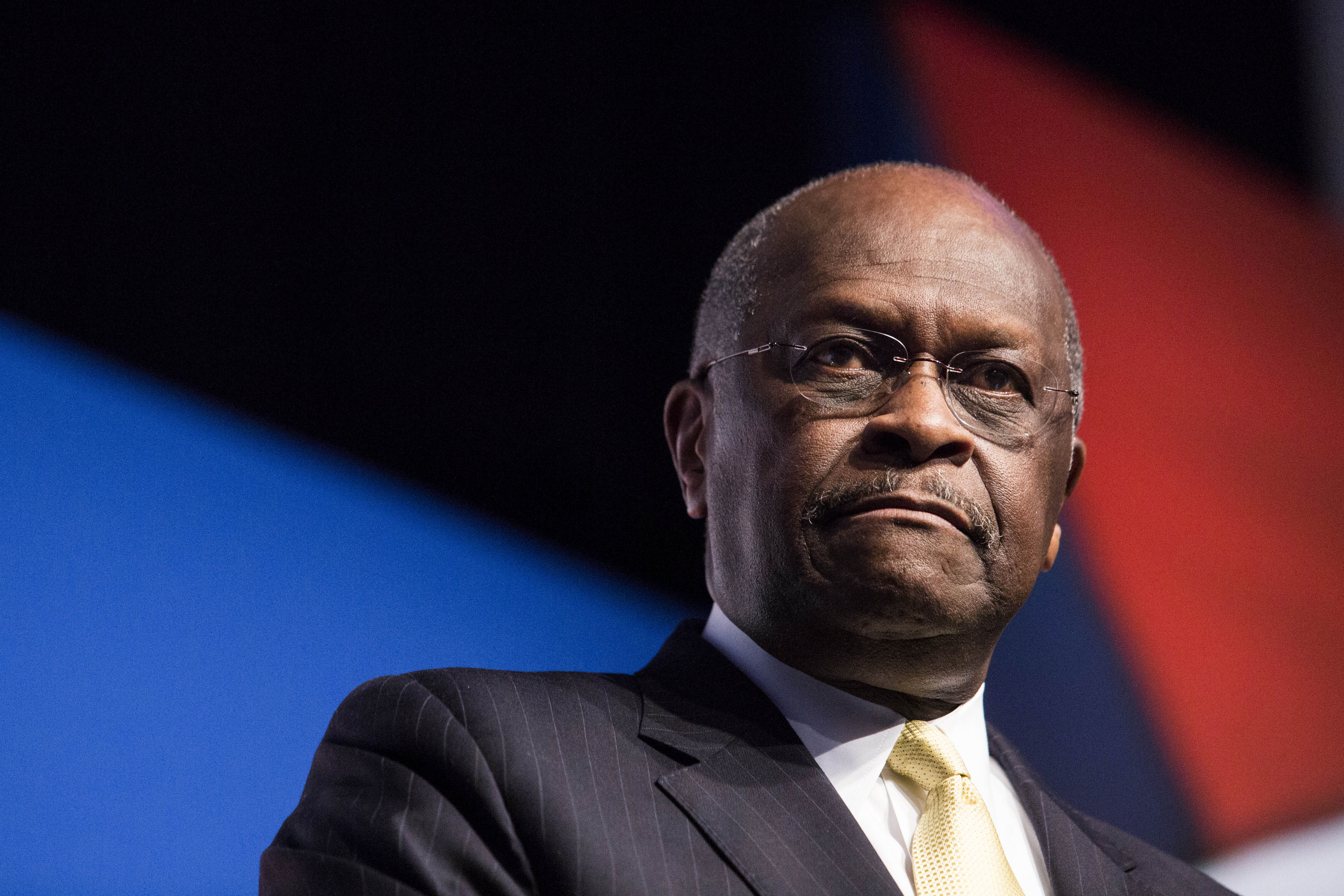 Herman Cain speaks at a conference in Washington, DC, on June 20, 2014.