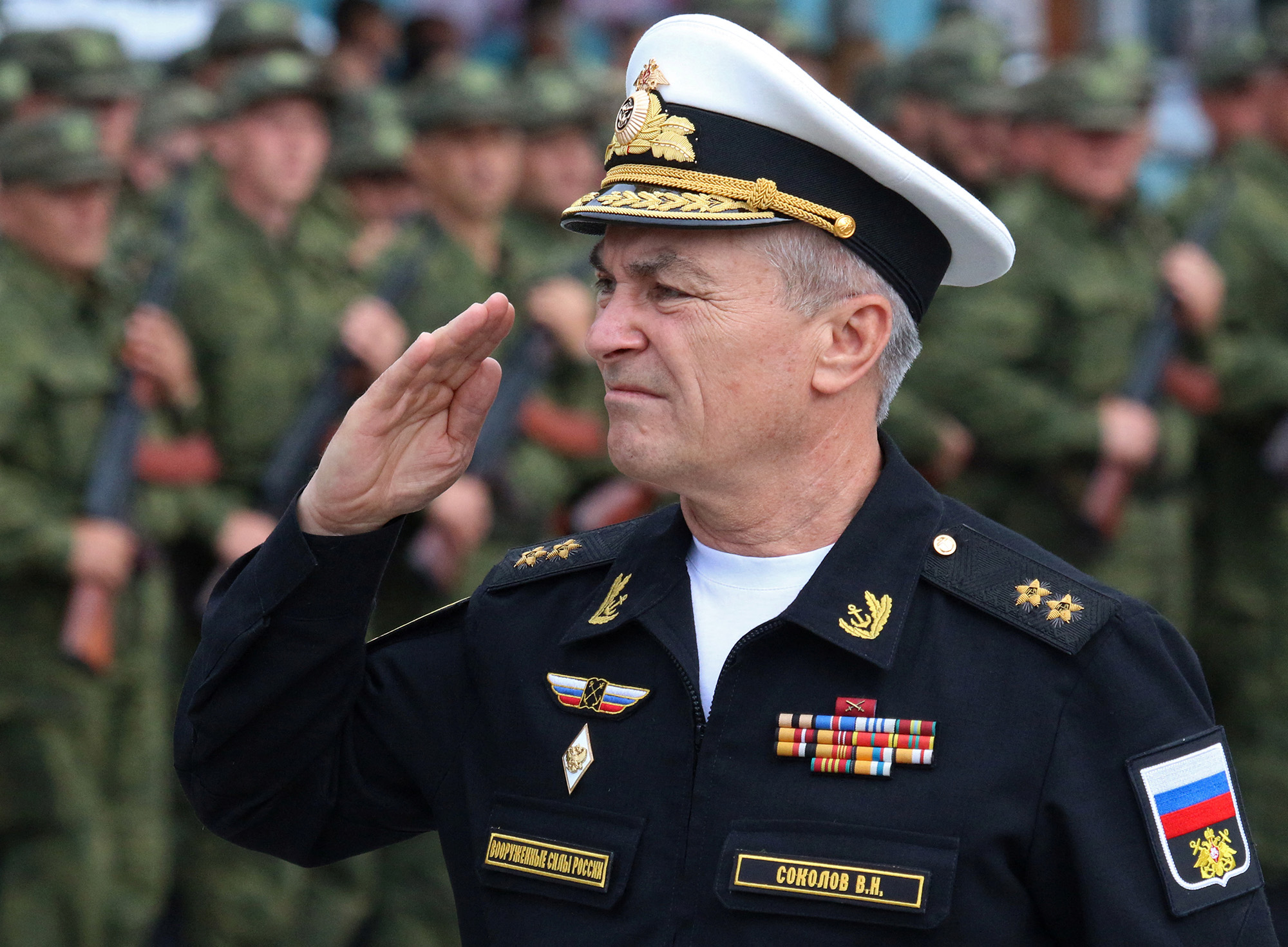 Commander of the Russian Black Sea Fleet Vice-Admiral Viktor Sokolov salutes during a send-off ceremony for reservists drafted during partial mobilisation, in Sevastopol, Crimea, on September 27, 2022.