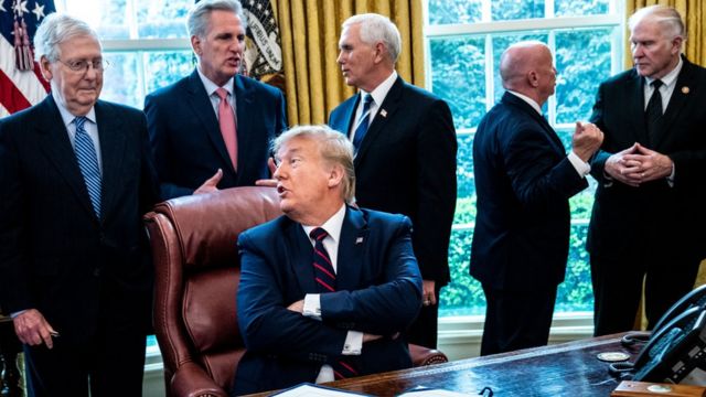 President Donald Trump speaks with Senate Majority Leader Mitch McConnell (left)