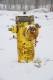 A fire hydrant during winter that is clear from snow.