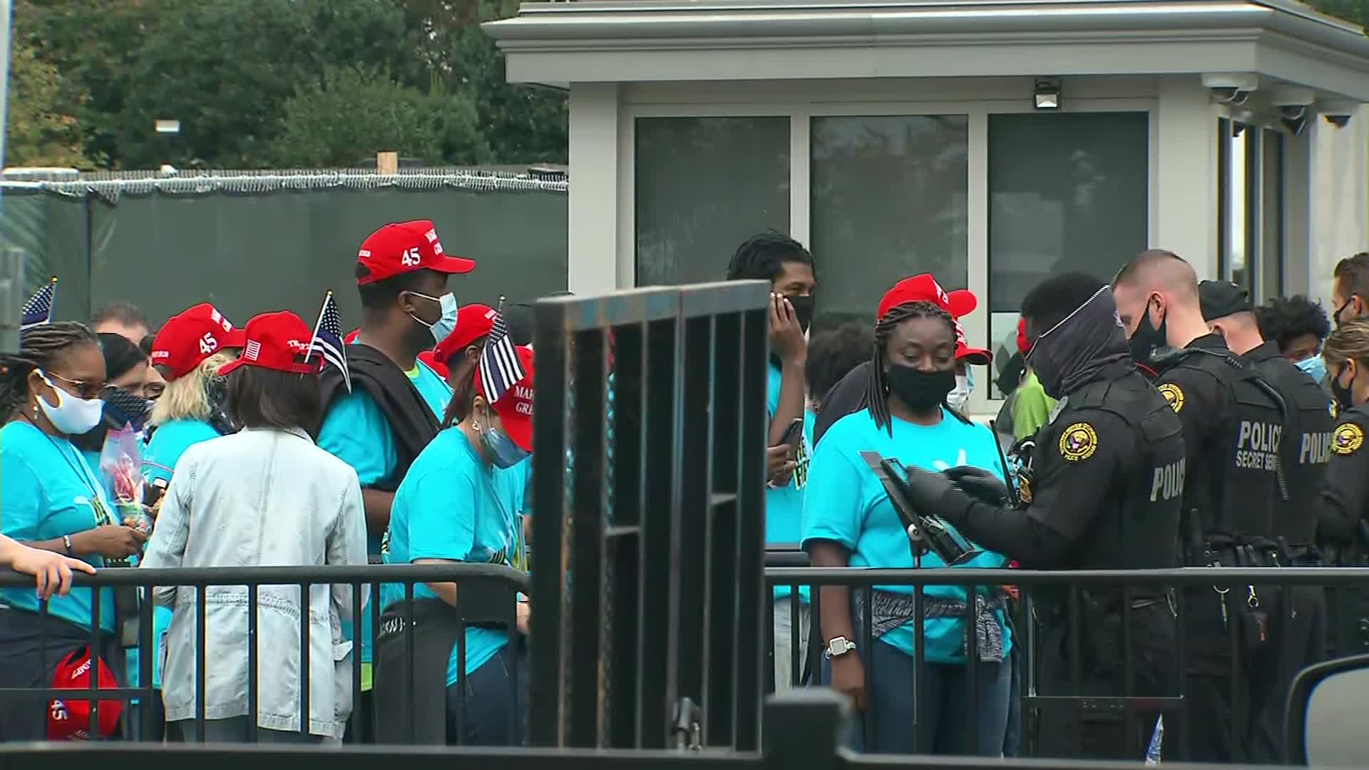 People line up on October 10 to get onto the White House grounds for President Donald Trump's event.