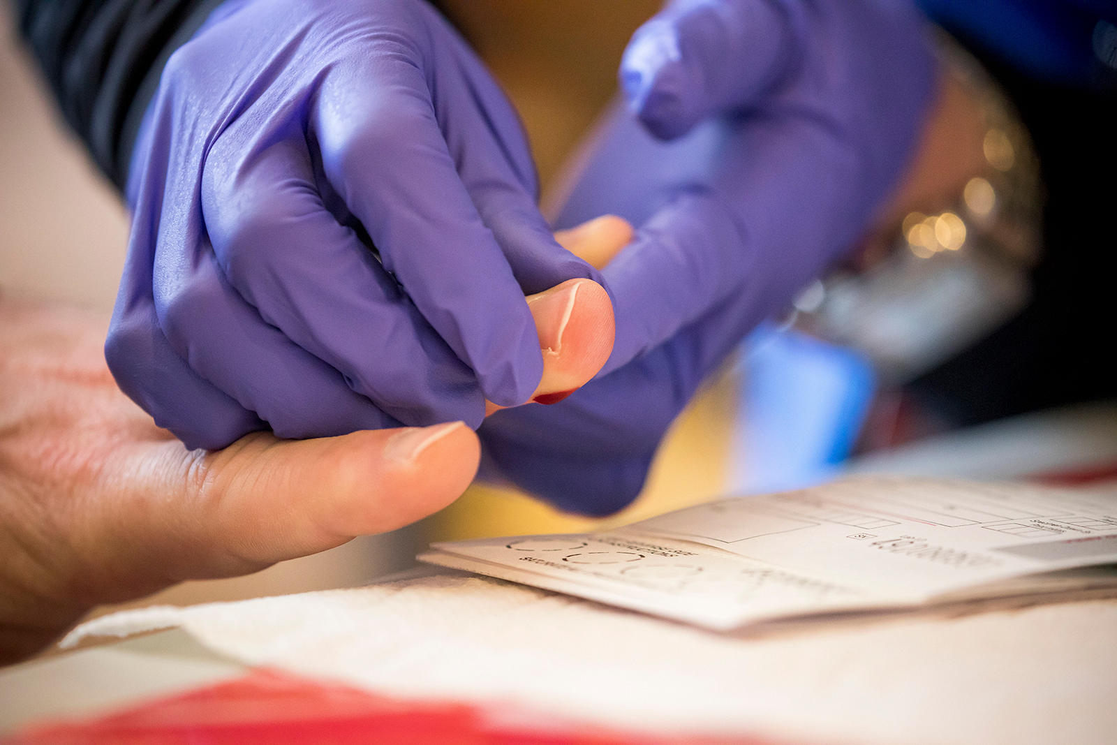 A healthcare worker takes a sample at a New York State Department of Health COVID-19 antibody testing center in Brooklyn, New York, on April 25. 