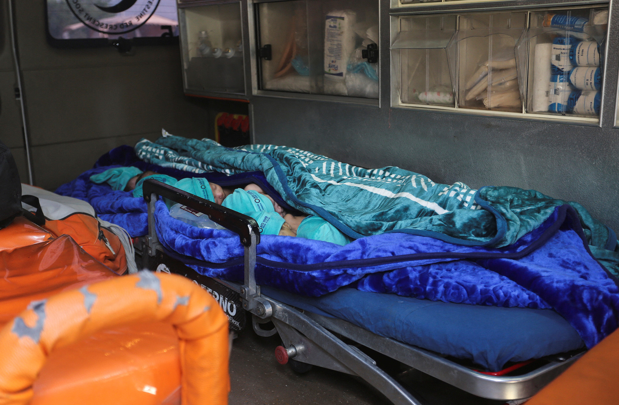 Premature babies, who were evacuated from Al-Shifa hospital, lie in an ambulance before they are transported via the Rafah crossing into Egypt on November 20.