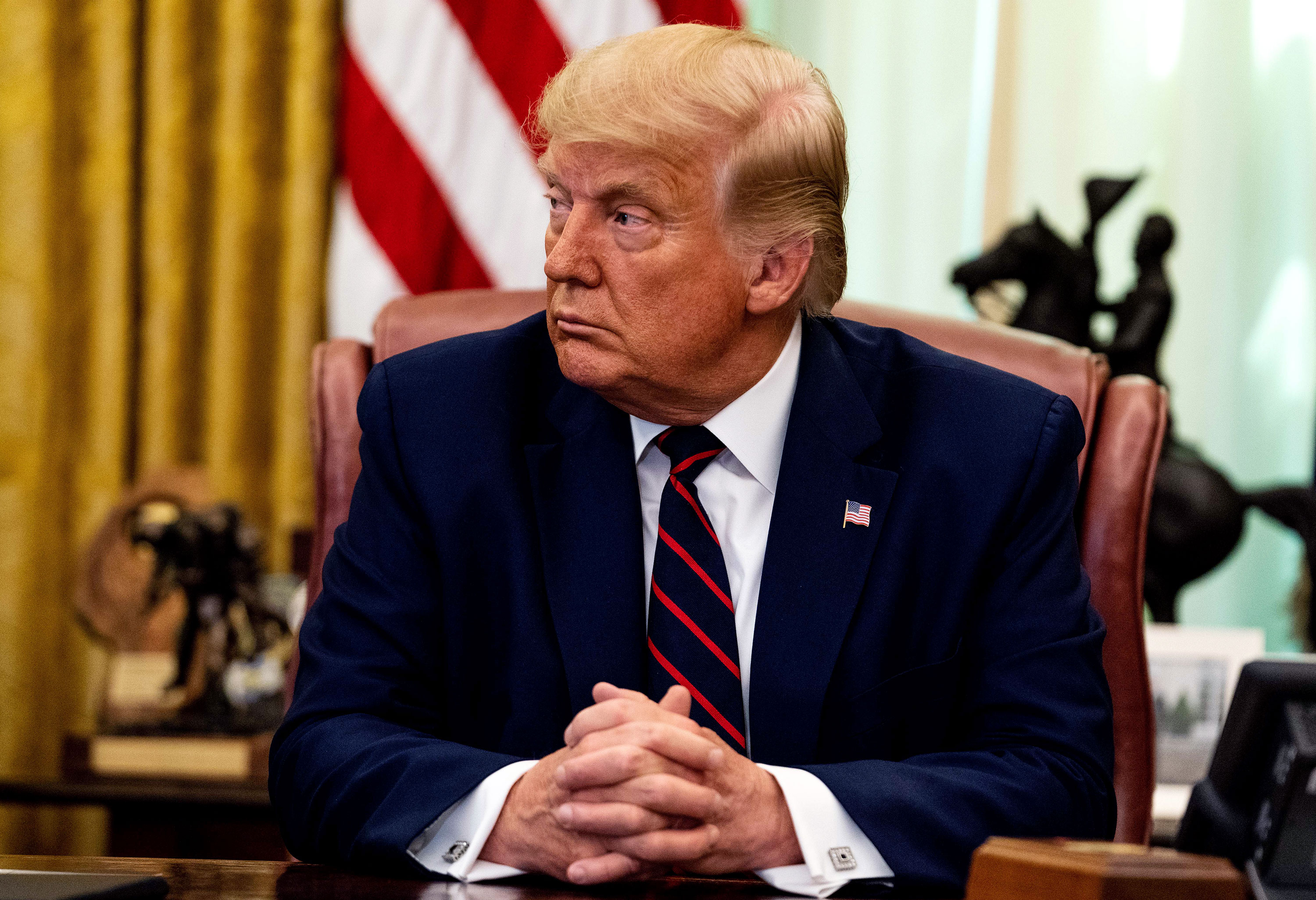 President Donald Trump attends a meeting in the Oval Office on September 4 in Washington, DC.