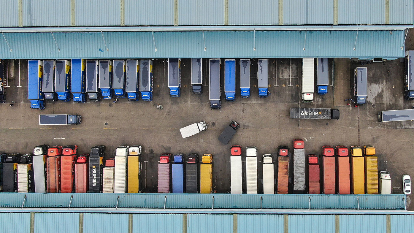 This aerial photo taken on June 16, 2020 shows trucks at a logistics center in Nantong, in China's eastern Jiangsu province. 