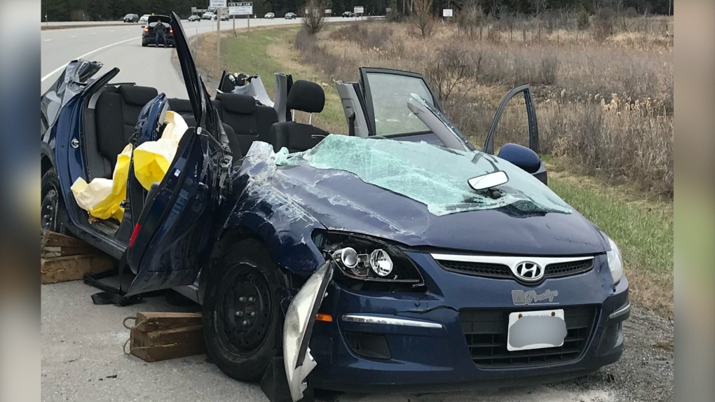 Two people were seriously injured, including one who was trapped, after this vehicle rolled on Highway 416 near West Hunt Club Road, April 23, 2022. Ottawa firefighters removed the roof to free the trapped person. (Ottawa Fire Service/Twitter)