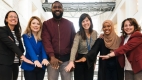 Members of the ANCHOR project team standing together inside City Hall.