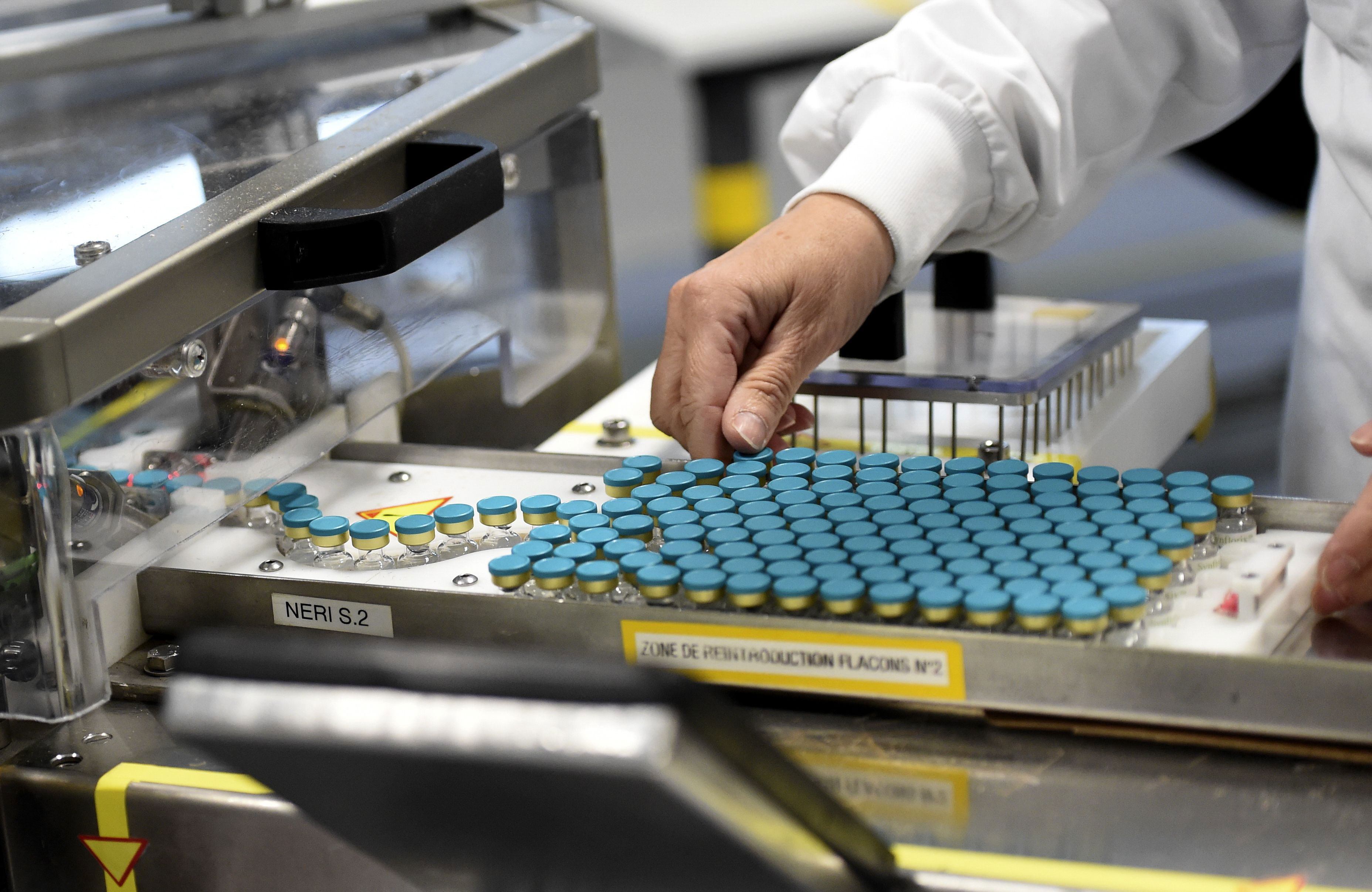 An employee works at a GlaxoSmithKline factory in Saint-Amand-les-Eaux, France, on December 3, where the adjuvant for Covid-19 vaccines will be manufactured.