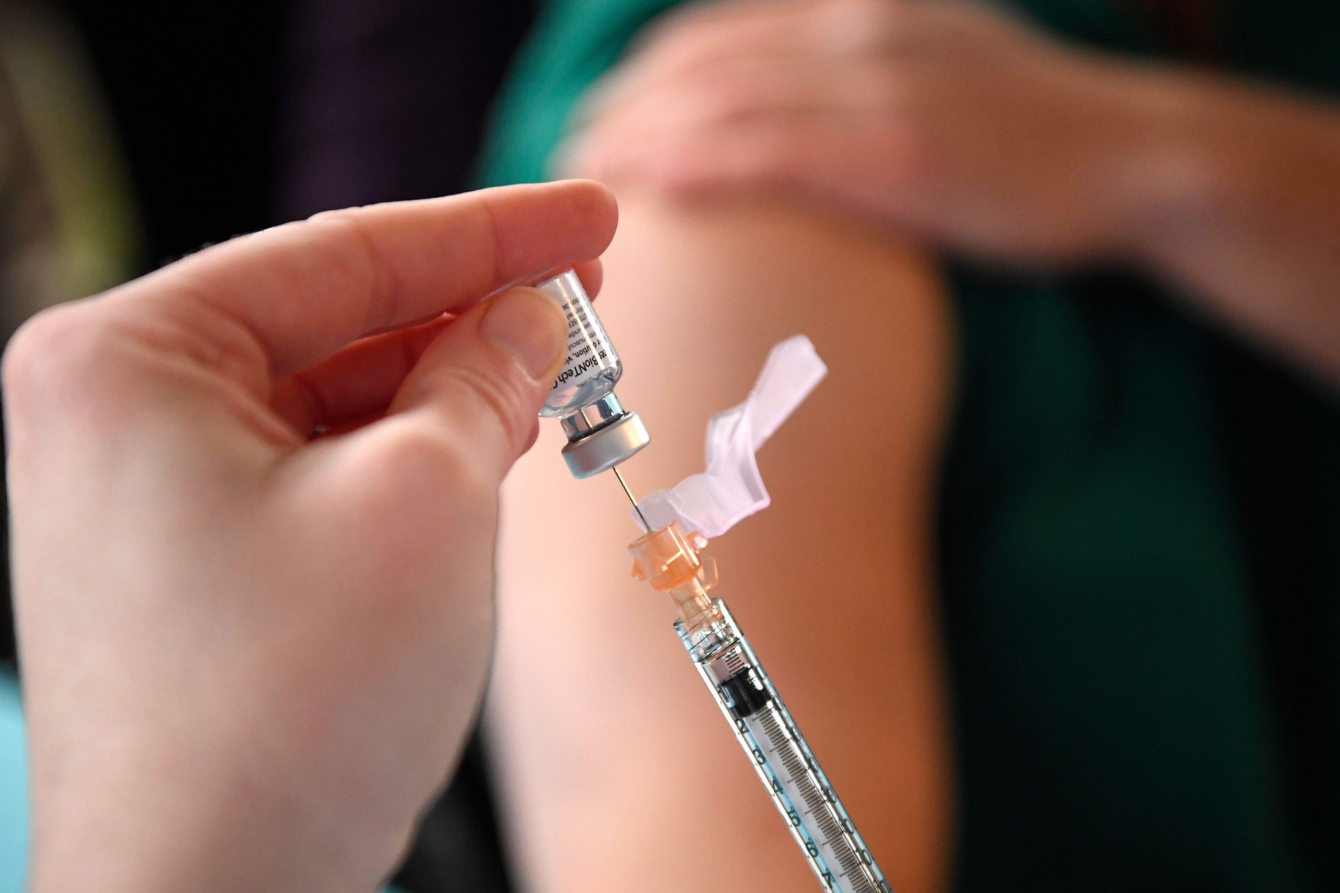 A system pharmacy clinical manager at Hartford HealthCare prepares the Pfizer-BioNTech Covid-19 vaccine in Hartford, Connecticut, on December 14.