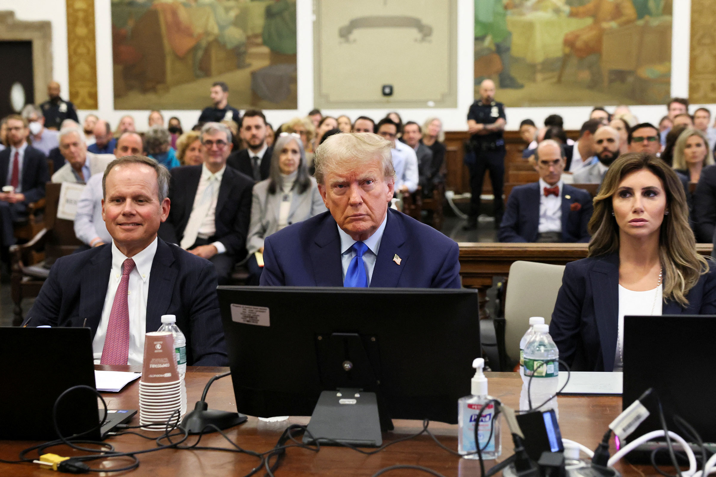 Former President Donald Trump sits in a courtroom at the start of a civil fraud trial in New York on Monday, October 2.