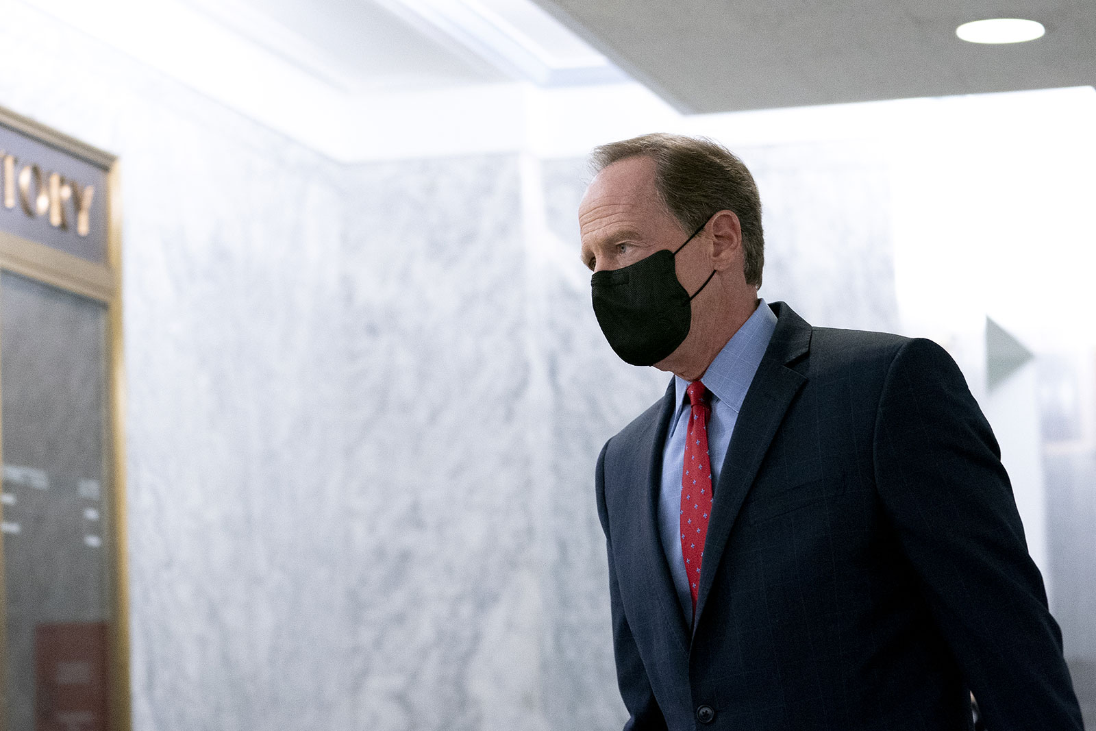 Sen. Pat Toomey walks through the Hart Senate Office Building in Washington, DC, on November 12.