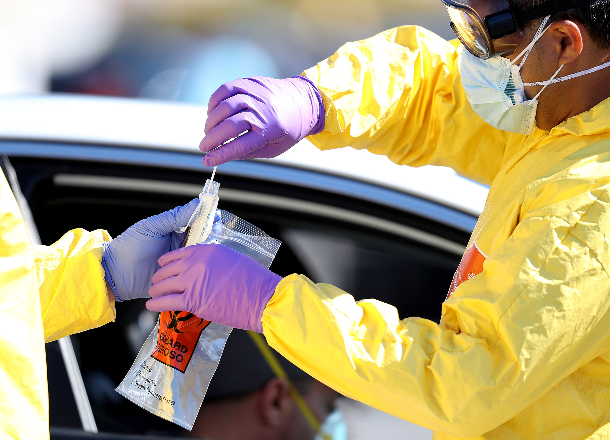 Coronavirus tests are administered at a drive-thru testing site in Jericho, New York, on April 6.