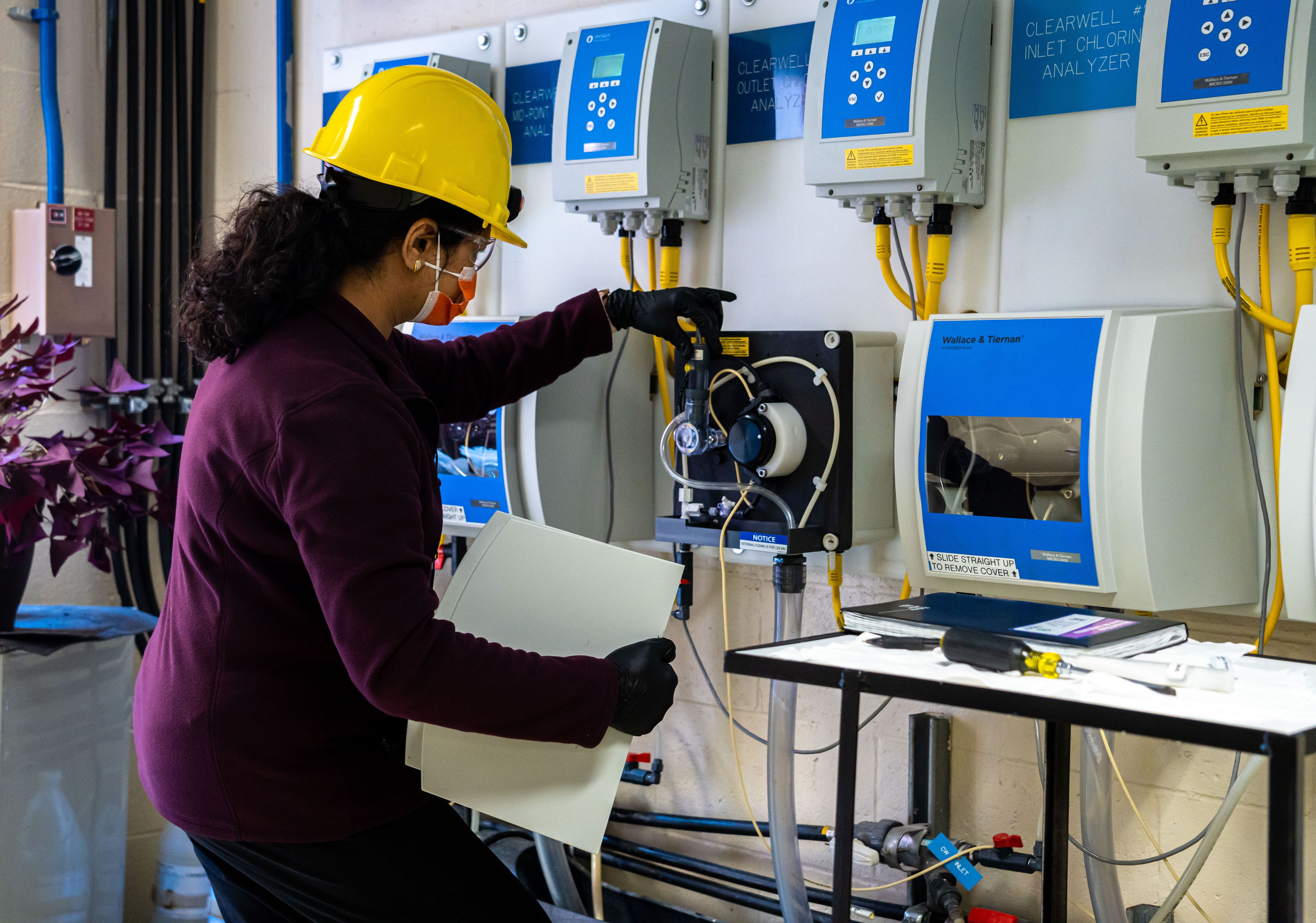 Water Quality Technologist Neha Vyas monitors chlorine levels during the disinfection stage of treatment. Water Quality Technologist Neha Vyas monitors chlorine levels during the disinfection stage of treatment.
