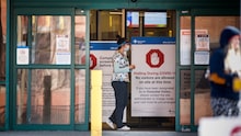 Peter Lougheed Centre hospital staff wait to screen essential visitors who are the only visitors permitted in Alberta hospitals as part of COVID-19 precautions in Calgary, Alta., Thursday, April 9, 2020. THE CANADIAN PRESS/Jeff McIntosh Peter Lougheed Centre hospital staff wait to screen essential visitors who are the only visitors permitted in Alberta hospitals as part of COVID-19 precautions in Calgary, Alta., Thursday, April 9, 2020. THE CANADIAN PRESS/Jeff McIntosh